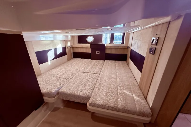 Tom's Cruise Yacht Photos Pics Luxurious interior cabin of 2016 Cranchi M 44 HT yacht with elegant bedding.