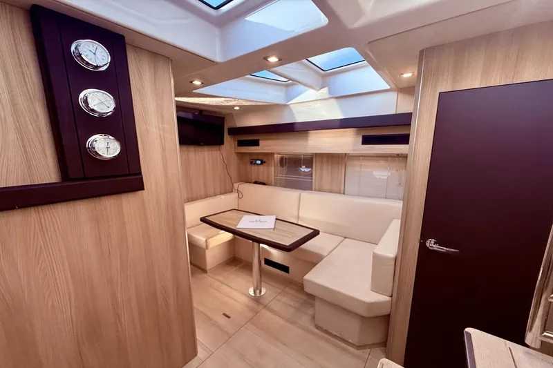 Tom's Cruise Yacht Photos Pics Luxurious interior of 2016 Cranchi M 44 HT yacht with elegant seating and modern decor.