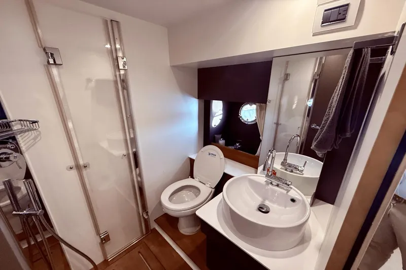 Tom's Cruise Yacht Photos Pics Luxurious bathroom in 2016 Cranchi M 44 HT yacht with modern fixtures.