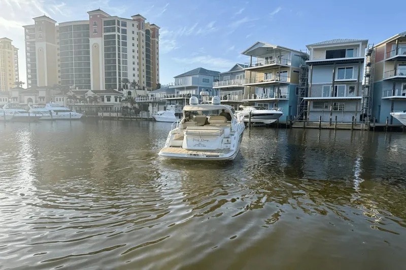 Tom's Cruise Yacht Photos Pics 2016 Cranchi M 44 HT yacht docked near waterfront buildings.