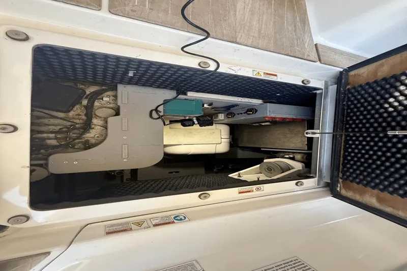 Tom's Cruise Yacht Photos Pics Engine compartment of 2016 Cranchi M 44 HT yacht, showcasing mechanical components and wiring.