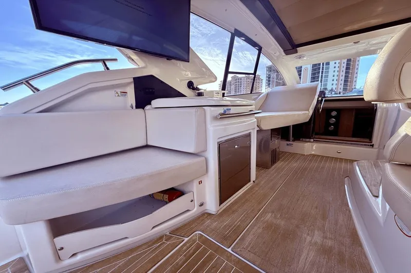 Tom's Cruise Yacht Photos Pics Interior of 2016 Cranchi M 44 HT yacht with modern seating and wood flooring.