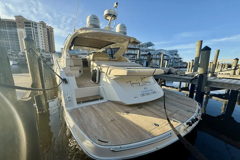 Tom's Cruise Yacht Photos Pics 2016 Cranchi M 44 HT yacht docked at marina with clear blue sky.