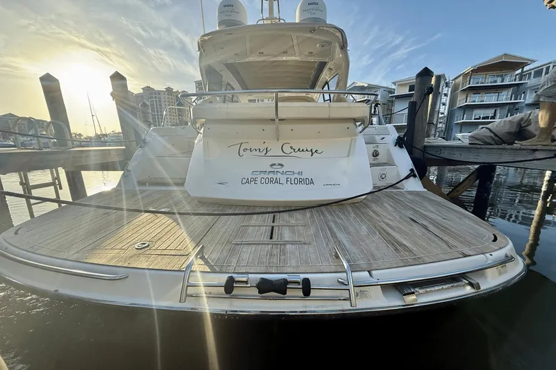 Tom's Cruise Yacht Photos Pics 2016 Cranchi M 44 HT yacht docked in Cape Coral, Florida, at sunset.