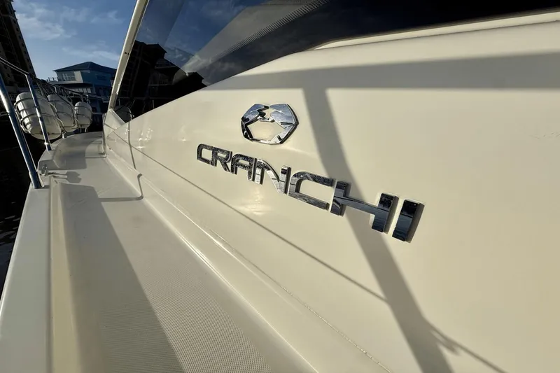 Tom's Cruise Yacht Photos Pics 2016 Cranchi M 44 HT yacht, side view with logo in sunlight.