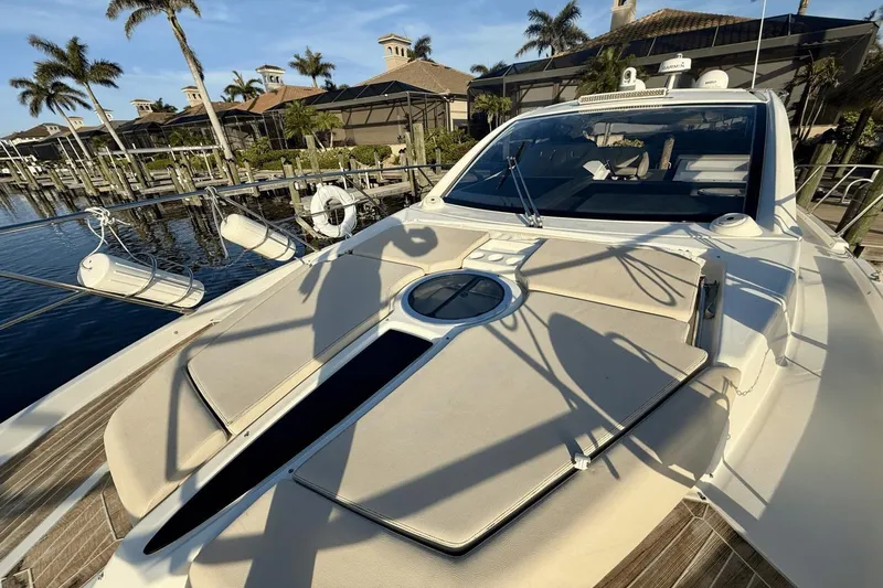 Tom's Cruise Yacht Photos Pics 2016 Cranchi M 44 HT yacht docked, featuring sleek design and sunbathing area.