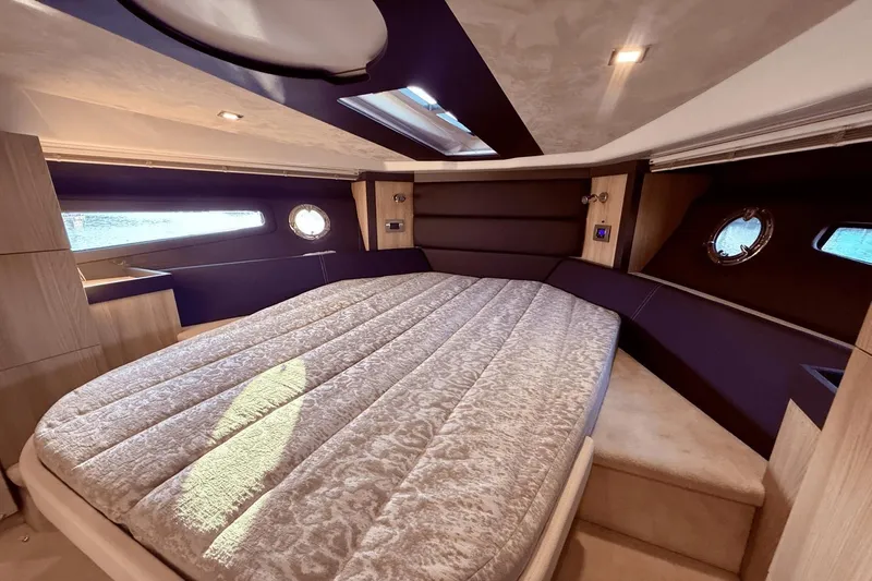 Tom's Cruise Yacht Photos Pics Luxurious interior cabin of 2016 Cranchi M 44 HT yacht with elegant bedding.