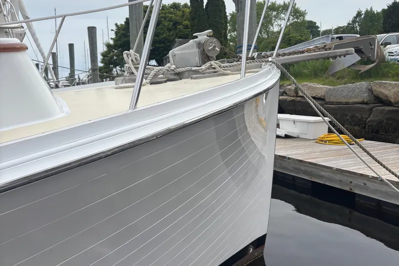 Carroll L Yacht Photos Pics Bow of a 2001 Lowell 40 boat docked, featuring sleek white hull and anchor.