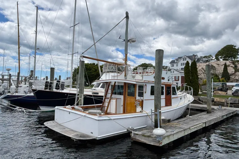 Carroll L Yacht Photos Pics Lowell 40 boat docked at marina, cloudy sky, 2001 model.