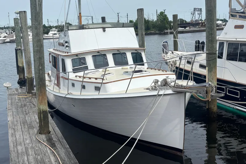 Carroll L Yacht Photos Pics Lowell 40 boat, 2001 model, docked at marina with other vessels.