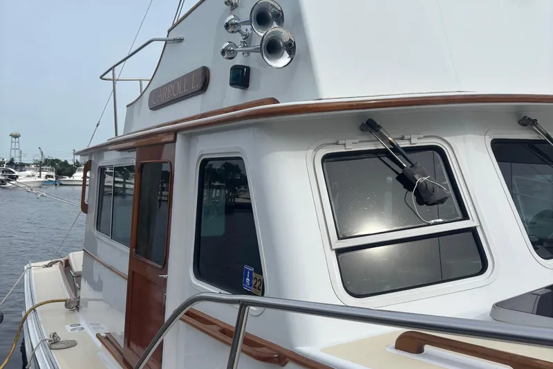 Carroll L Yacht Photos Pics Boat docked at marina, Lowell 40 model, 2001, with wooden accents and windows.