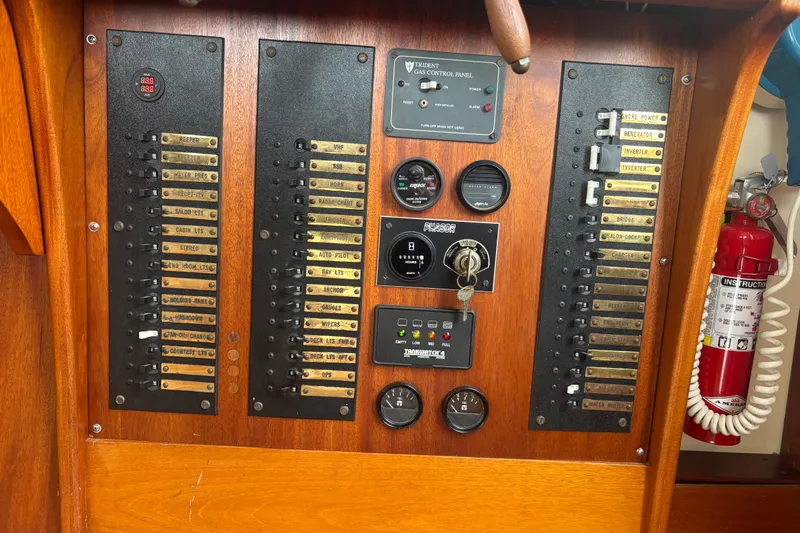Carroll L Yacht Photos Pics Electrical control panel on a 2001 Lowell 40 boat, featuring switches and gauges.