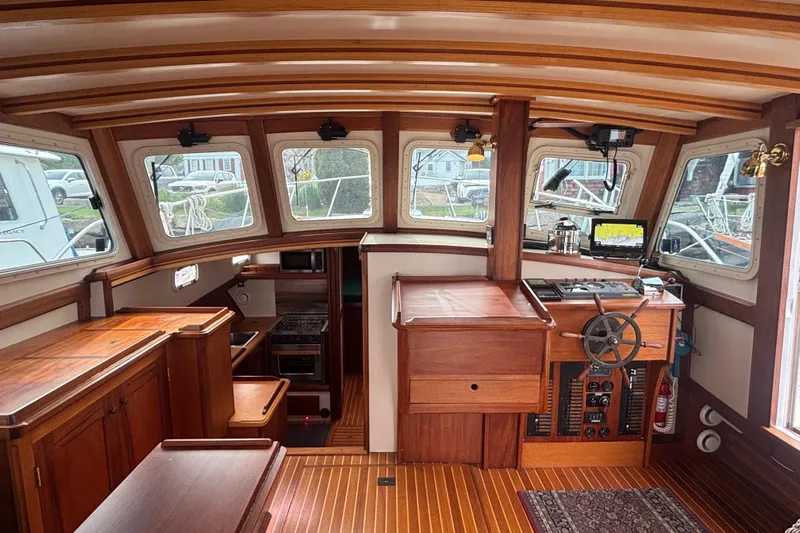 Carroll L Yacht Photos Pics Interior of a 2001 Lowell 40 boat with wooden furnishings and navigation equipment.