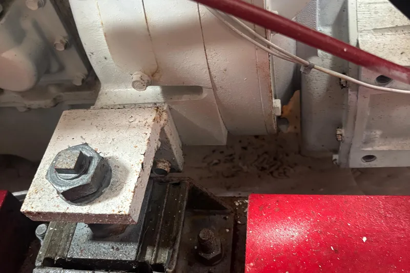 Carroll L Yacht Photos Pics Close-up of Lowell 40 machinery component with visible bolts and red metal part, 2001 model.