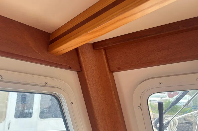Carroll L Yacht Photos Pics Interior view of a 2001 Lowell 40 boat, showcasing wooden trim and window details.