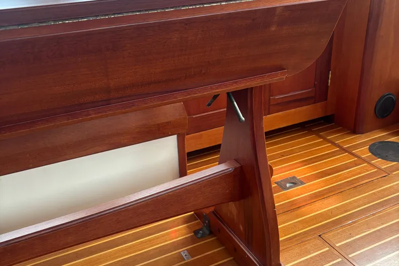 Carroll L Yacht Photos Pics Wooden interior of a 2001 Lowell 40 boat, featuring polished flooring and furniture.