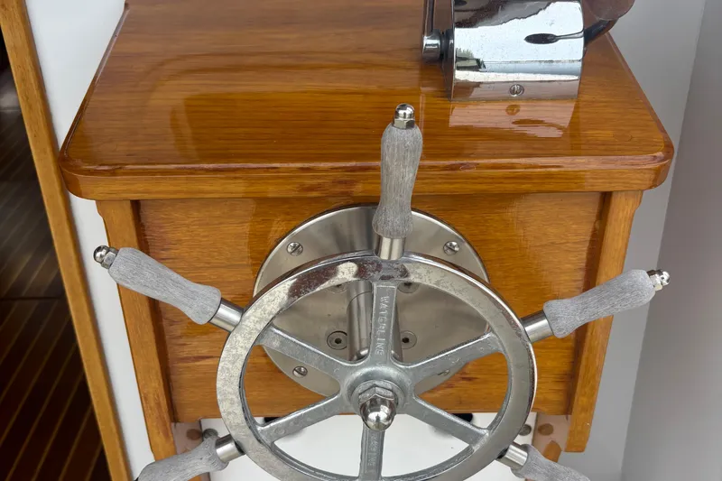 Carroll L Yacht Photos Pics Wooden helm of a 2001 Lowell 40 boat with metal steering wheel.