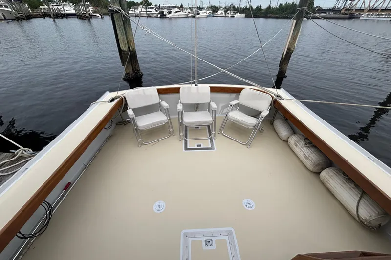 Carroll L Yacht Photos Pics Lowell 40 boat deck with chairs, docked at marina, 2001 model.