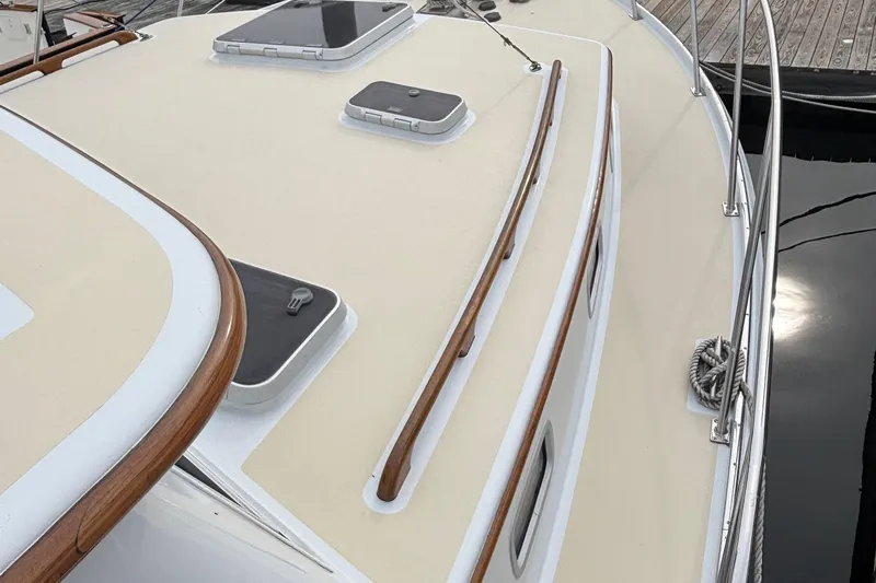 Carroll L Yacht Photos Pics Deck of a 2001 Lowell 40 boat with wooden trim and hatches.