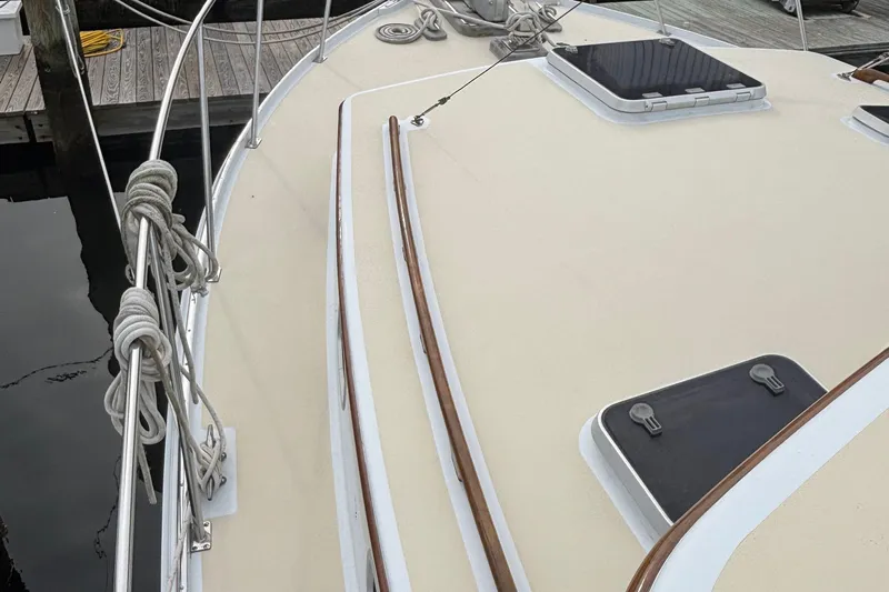 Carroll L Yacht Photos Pics Deck of a 2001 Lowell 40 boat with hatches and docked ropes.