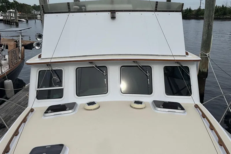 Carroll L Yacht Photos Pics Front view of a 2001 Lowell 40 boat docked at a marina.