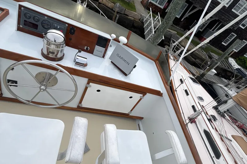 Carroll L Yacht Photos Pics Helm of 2001 Lowell 40 boat with Garmin navigation system and wooden accents.