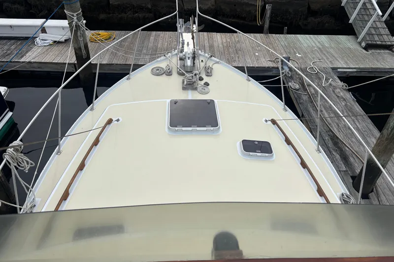 Carroll L Yacht Photos Pics Bow view of a 2001 Lowell 40 boat docked at a marina.