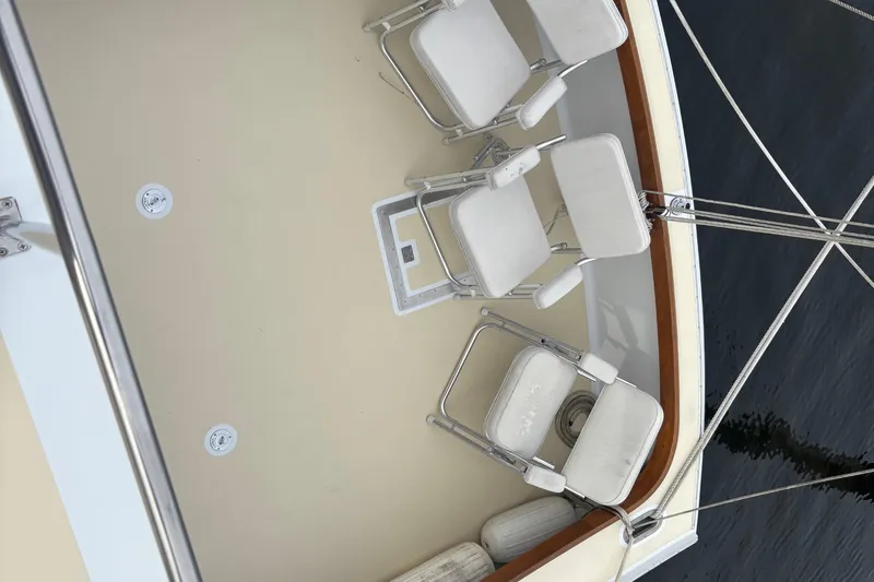 Carroll L Yacht Photos Pics Deck of a 2001 Lowell 40 boat with white folding chairs.