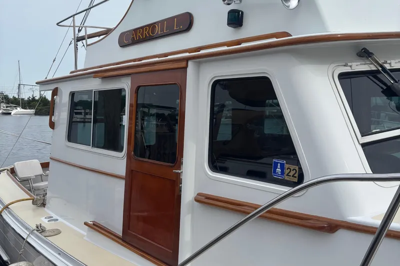 Carroll L Yacht Photos Pics 2001 Lowell 40 boat named "Carroll L." docked at a marina.