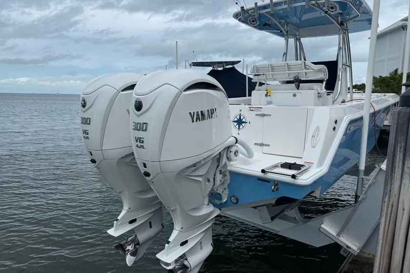  Yacht Photos Pics 2024 Contender 30 Tournament boat with twin Yamaha 300 V6 outboard engines docked by the water.