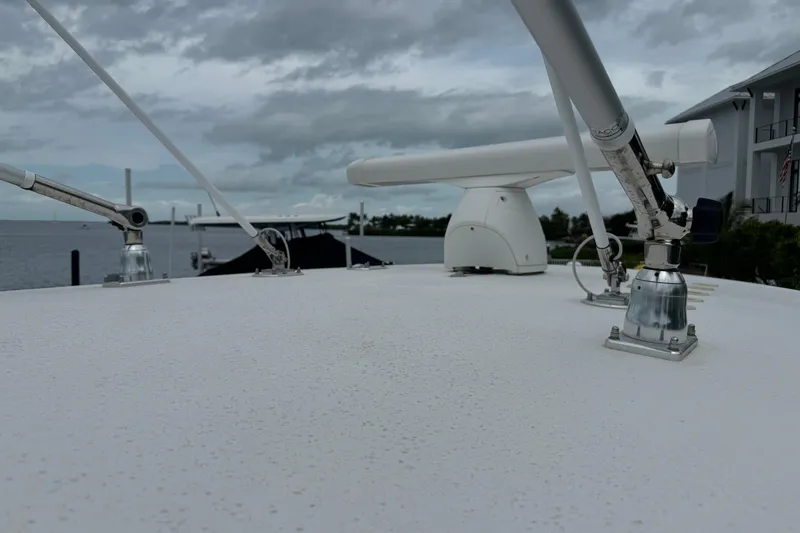  Yacht Photos Pics 2024 Contender 30 Tournament boat deck with radar and antennas, overcast sky.