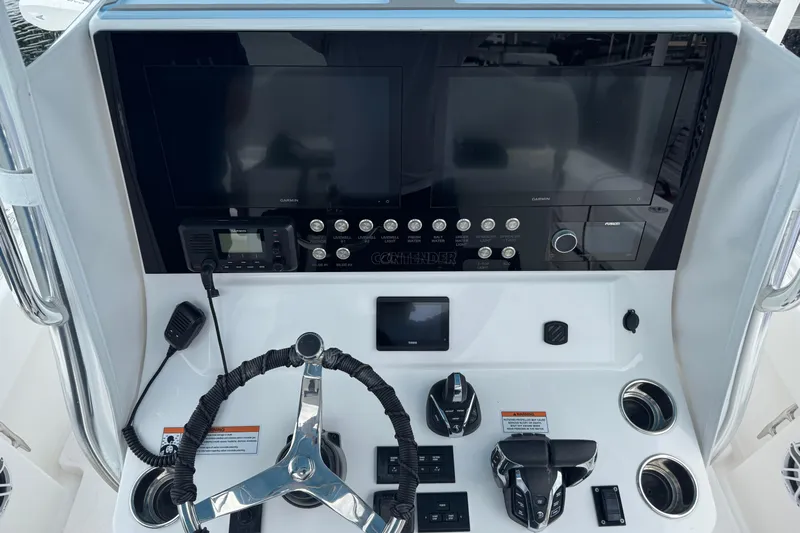  Yacht Photos Pics 2024 Contender 30 Tournament boat dashboard with advanced controls and navigation screens.