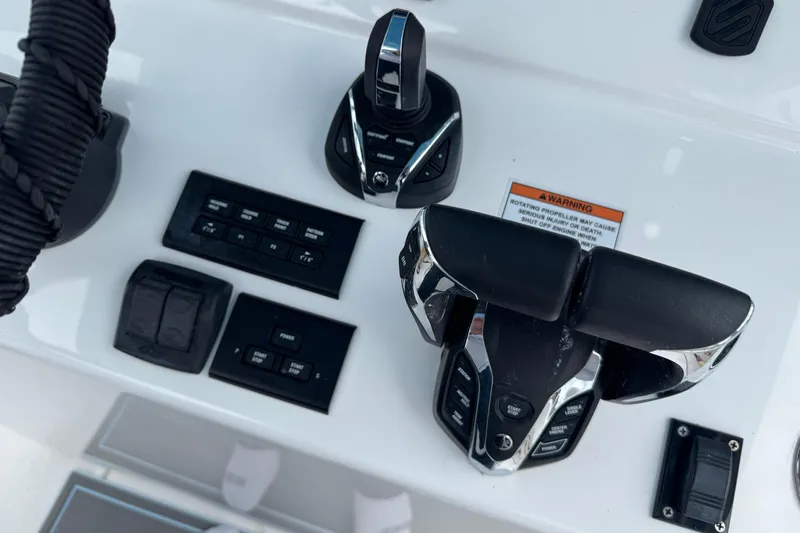  Yacht Photos Pics Control panel of 2024 Contender 30 Tournament boat with throttle and switches.