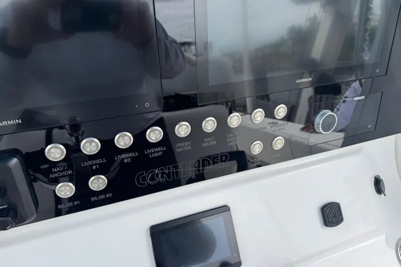  Yacht Photos Pics 2024 Contender 30 Tournament dashboard with Garmin displays and control buttons.