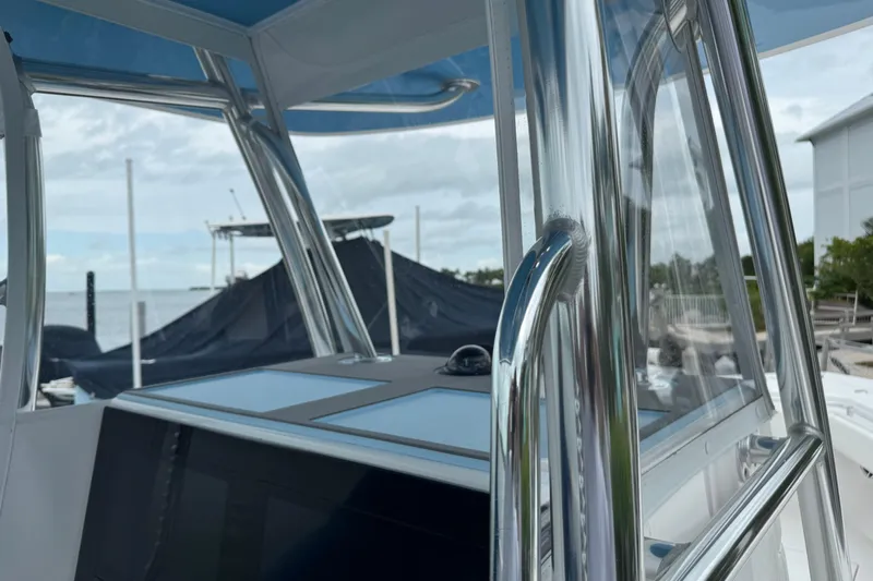  Yacht Photos Pics 2024 Contender 30 Tournament boat with sleek metal railings and modern design.