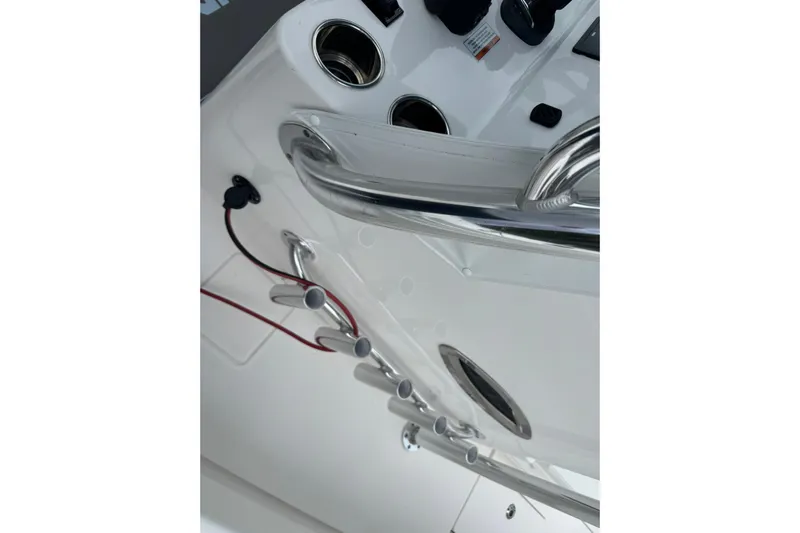  Yacht Photos Pics 2024 Contender 30 Tournament boat console with cup holders and stainless steel railings.