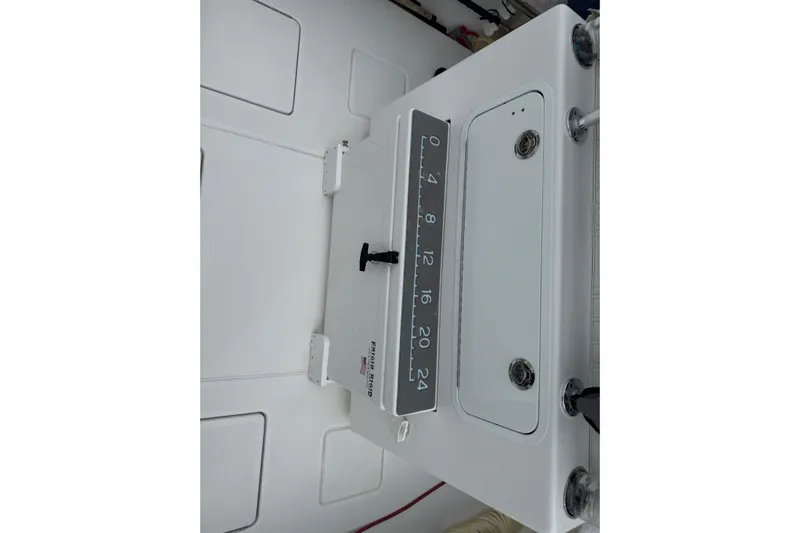  Yacht Photos Pics 2024 Contender 30 Tournament boat interior with measuring board and storage compartments.