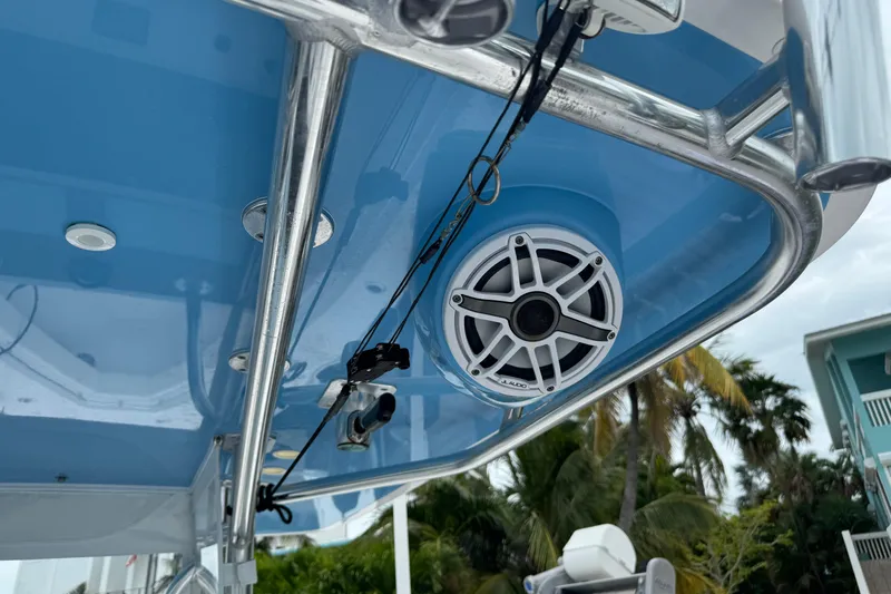  Yacht Photos Pics 2024 Contender 30 Tournament boat with blue canopy and mounted speaker system.