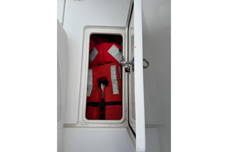  Yacht Photos Pics Storage compartment with red life jackets on a 2024 Contender 30 Tournament boat.