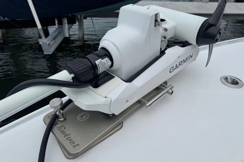 Yacht Photos Pics Garmin trolling motor on 2024 Contender 30 Tournament boat, docked by water.