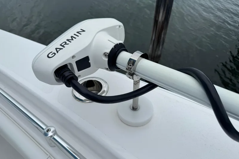  Yacht Photos Pics Garmin device mounted on 2024 Contender 30 Tournament boat, near water.