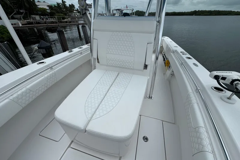  Yacht Photos Pics 2024 Contender 30 Tournament boat interior with white cushioned seating.