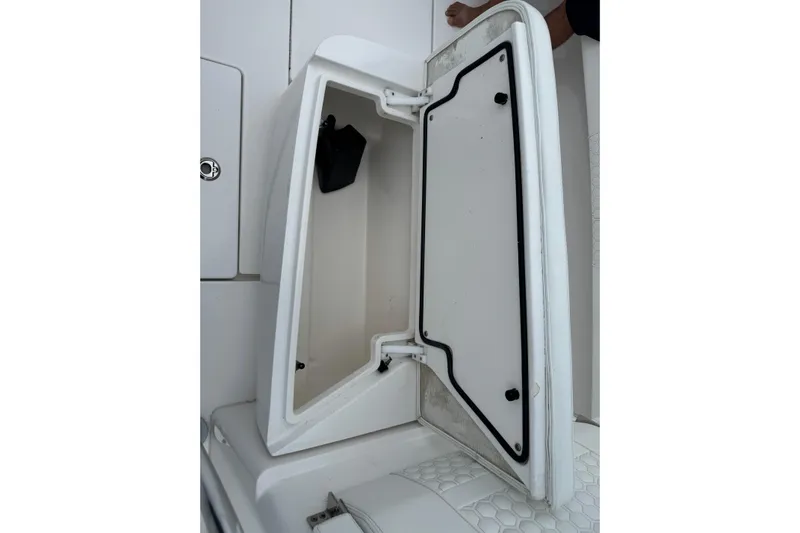  Yacht Photos Pics Open storage compartment on 2024 Contender 30 Tournament boat, showcasing interior space.