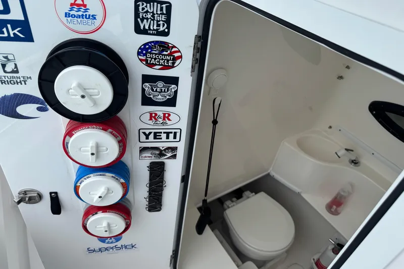  Yacht Photos Pics 2024 Contender 30 Tournament boat interior with fishing gear and restroom.