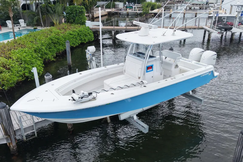  Yacht Photos Pics 2024 Contender 30 Tournament boat docked, featuring sleek design and dual engines.