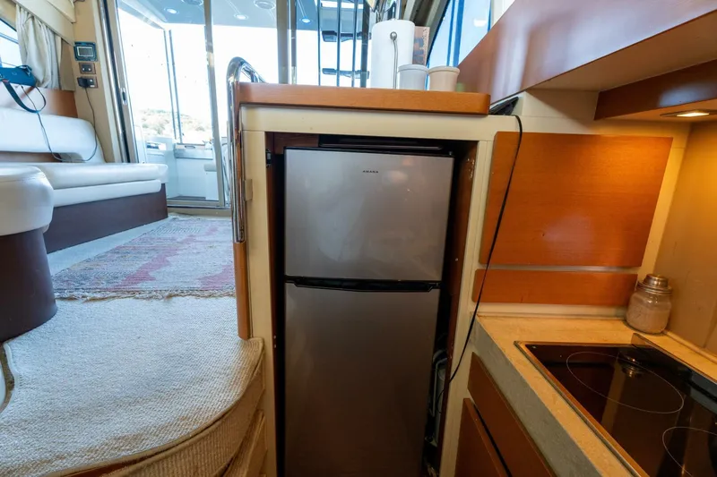  Yacht Photos Pics Azimut 40 Flybridge 2013 yacht interior with kitchenette and seating area.