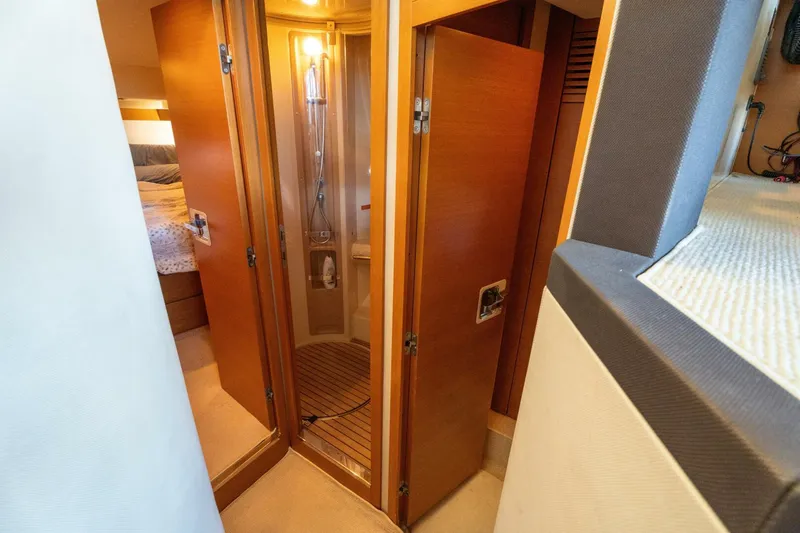  Yacht Photos Pics Interior of 2013 Azimut 40 Flybridge yacht featuring a compact bathroom with wooden accents.