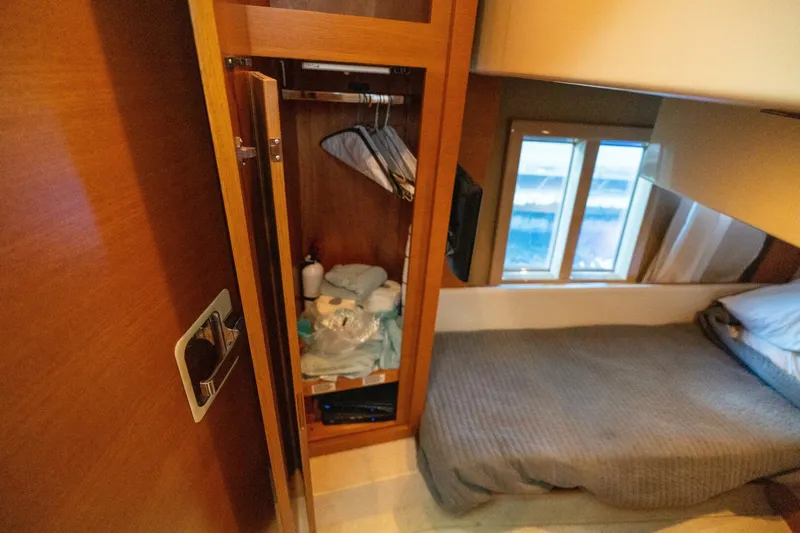  Yacht Photos Pics Cozy cabin interior of 2013 Azimut 40 Flybridge yacht with bed and storage.