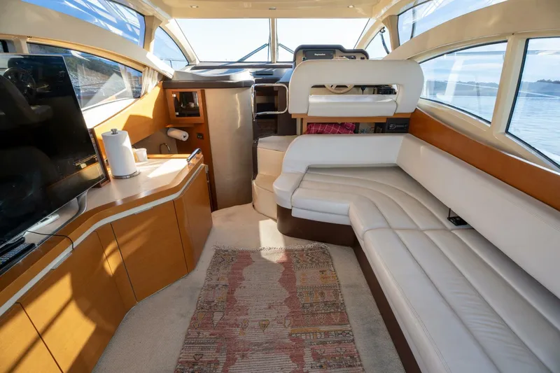  Yacht Photos Pics Luxurious interior of 2013 Azimut 40 Flybridge yacht with leather seating and panoramic windows.