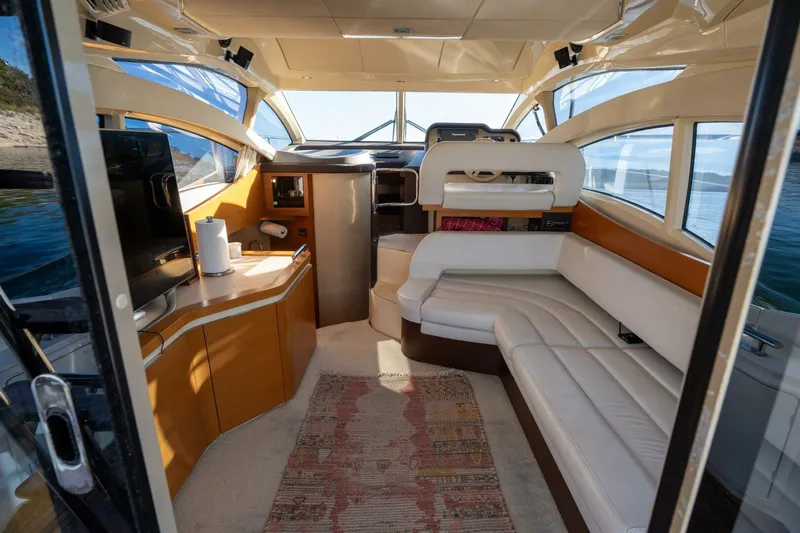  Yacht Photos Pics Luxurious interior of 2013 Azimut 40 Flybridge yacht with modern seating and panoramic windows.